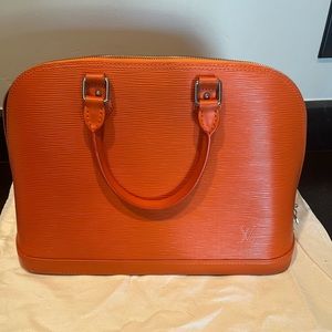 Large zippered tote in orange Epi leather.